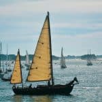 brown and white sail boat on sea during daytime