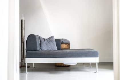 a couch that is sitting in the middle of a room