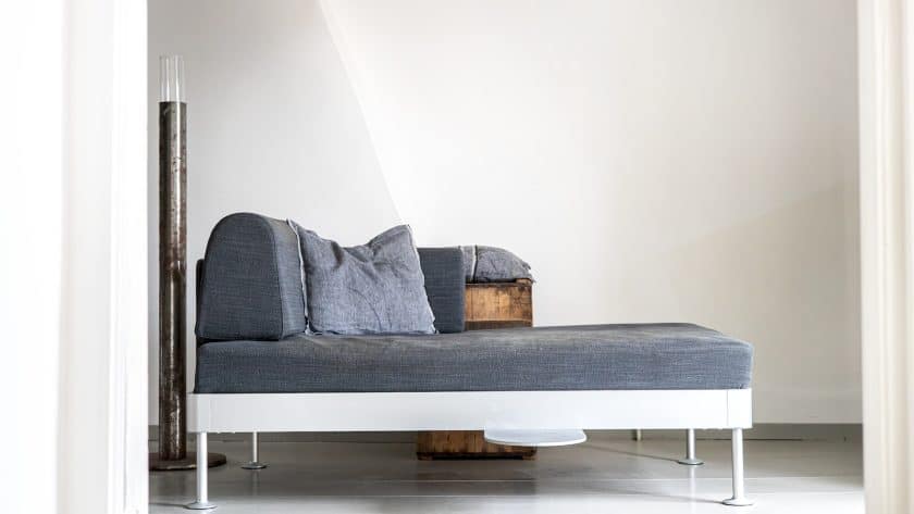 a couch that is sitting in the middle of a room